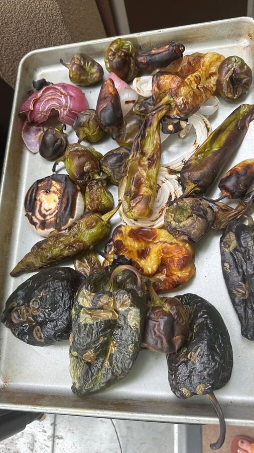A tray of fire-roasted eggplant, peppers, and onions