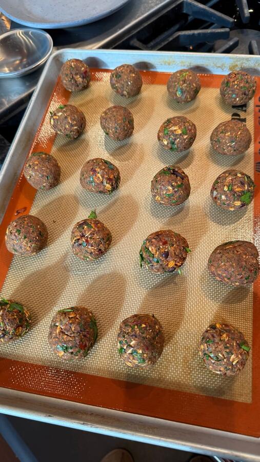 A tray of rolled bites ready for the oven