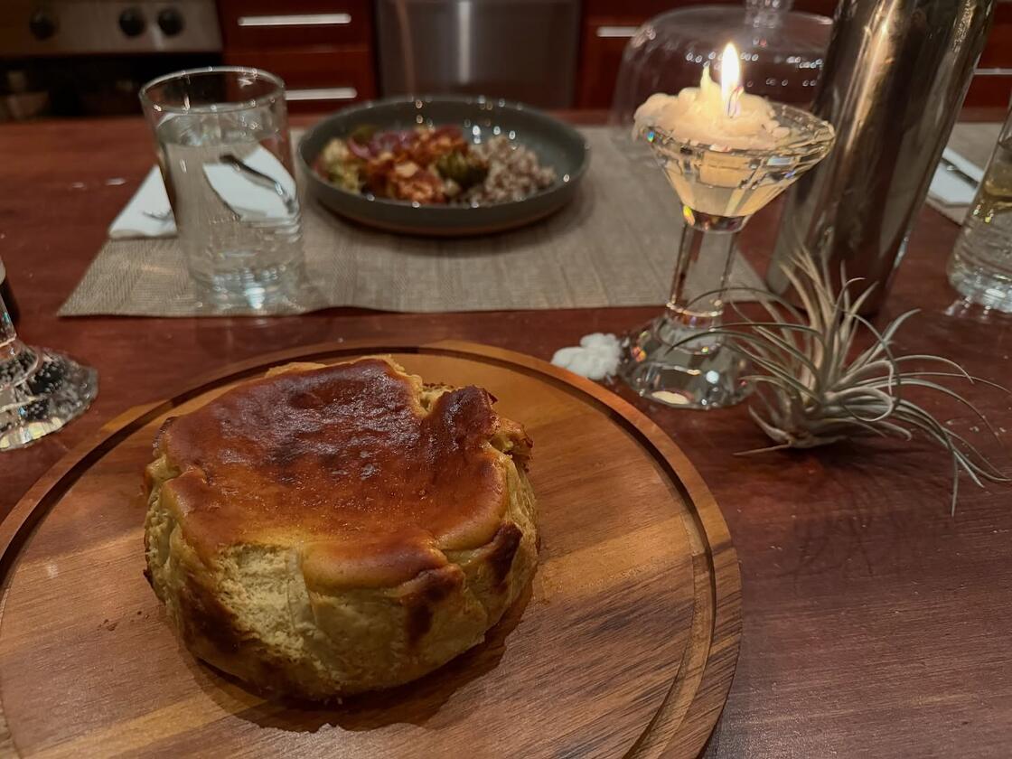A basque cheesecake on a wooden board
