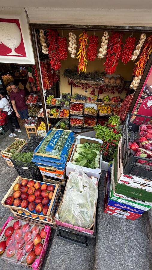 A shop stacked with produce and preserves