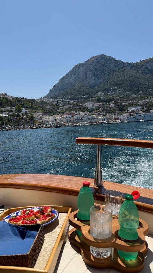 A wooden boat on the water off Capri