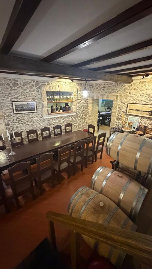 A wine cellar lined with barrels