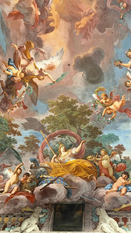 A ceiling fresco of figures in clouds